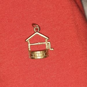Dainty and detailed brass wishing well pendant